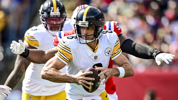 Aaron Rodgers of the Steelers prepares to throw the ball