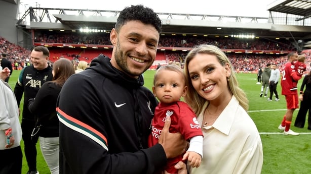 Footballer Alex Oxlade-Chamberlain and his partner Perrie Edwards pose for a picture with their son Axel