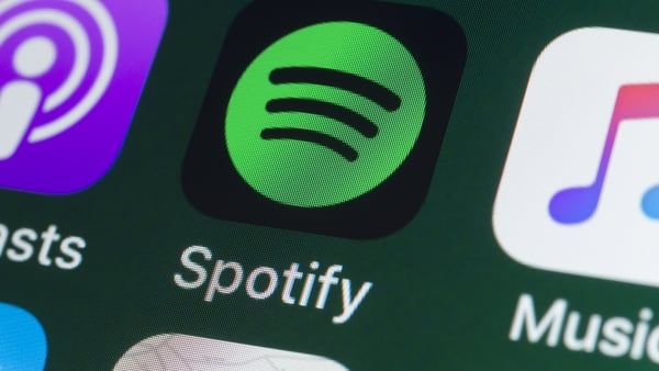 The button of the music streaming app Spotify on the screen of an iPhone
