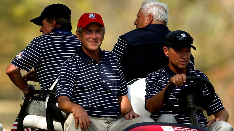 George W Bush (L) and American captain Davis Love III at the 2012 Ryder Cup