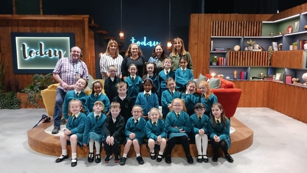 A group of schoolkids in green unifroms on the set of the RTÉ TV show today.