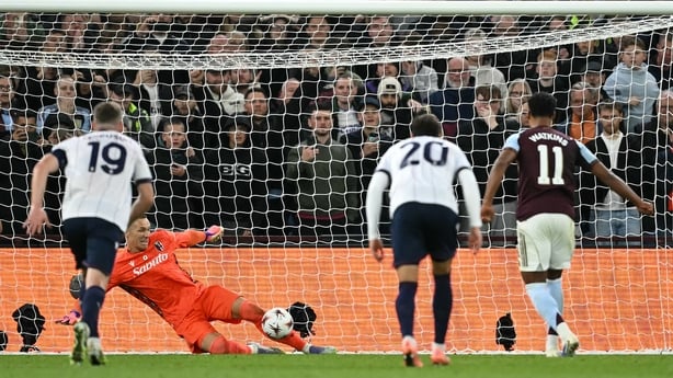 Lukasz Skorupski saves a penalty shot frmo Aston Villa's English striker #11 Ollie Watkins during the UEFA Europa League, league stage football match between Aston Villa and Bologna at Villa Park in Birmingham, central England on September 25, 2025