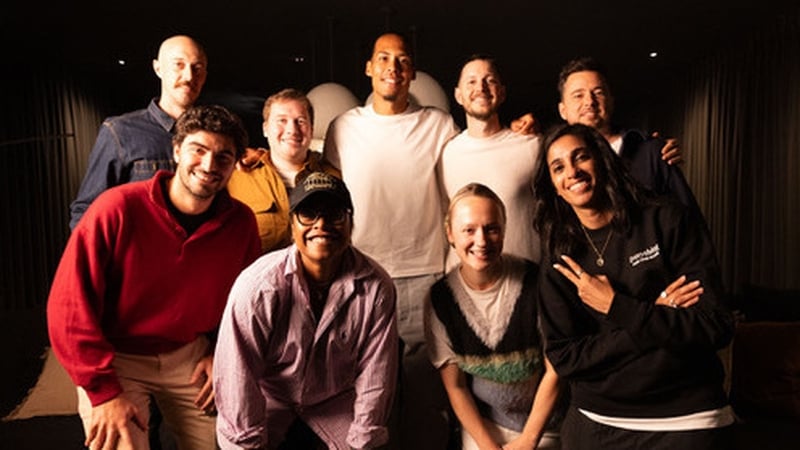 Eoin Lúc Ó Ceallaigh and his team with Liverpool captain Virgil van Dijk