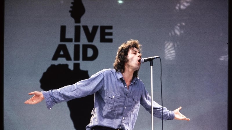 Bob Geldof performing at Wembley, with Live Aid logo in the background (Pic: Steve Rapport © The Band Aid Charitable Trust and The National Library of Ireland)