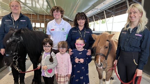 Children, staff and ponies stand for a photo at the opening of the Jack de Bromhead equine therapeutic centre