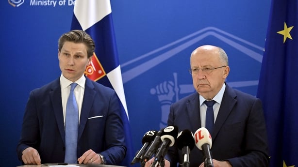 EU Commissioner for Defence and Space Andrius Kubilius and Finnish Defence Minister Antti Haekkaenen attend a press conference in Helsinki