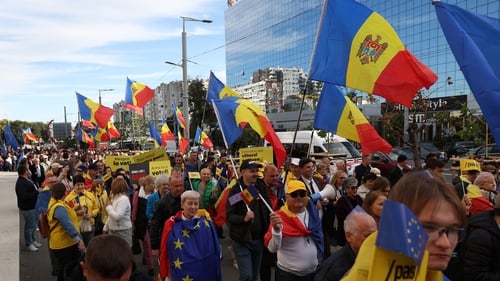 Supporters of the ruling Party of Action and Solidarity (PAS) during a pro-EU rally yesterday, on the final day of the electoral campaign in Chisinau, Moldova