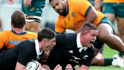 Cam Roigard, left, celebrates his try with New Zealand team-mate Ethan de Groot