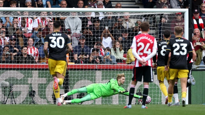 Brentford goalkeeper Caoimhín Kelleher saves Bruno Fernandes' second-half penalty at the Gtech Community Stadium