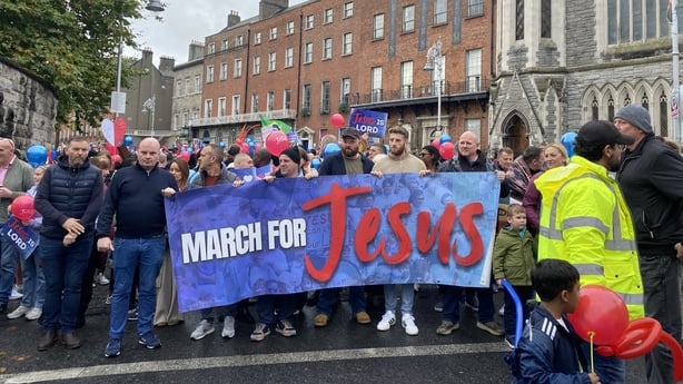 People take part in a March for Jesus at Parnell Square in Dublin