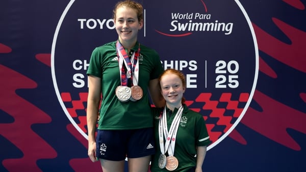 Roisin Ni Riain, left, and Dearbhaile Brady with their respective medals on the final day of competition at the World Para Swimming Championships in Singapore