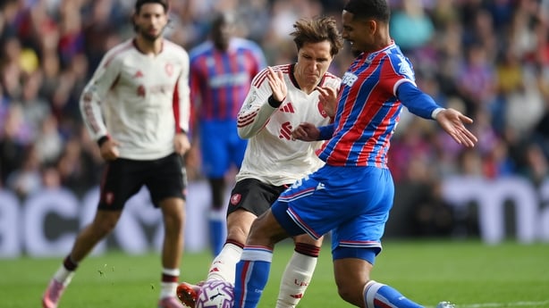Federico Chiesa of Liverpool battles for possession with Maxence Lacroix of Crystal Palace during the Premier League match between Crystal Palace and Liverpool at Selhurst Park on September 27, 2025 in London, England.