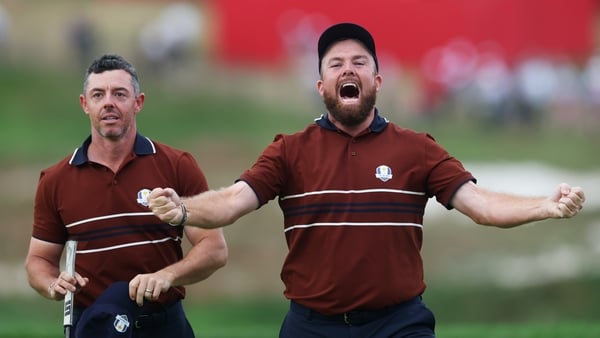 Rory McIlroy and Shane Lowry of Team Europe celebrate defeating Justin Thomas and Cameron Young of Team United States 2 Up on the 18th green during the Saturday afternoon four-balls matches of the 2025 Ryder Cup at Black Course at Bethpage State Park Golf
