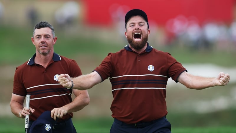 Rory McIlroy and Shane Lowry celebrate after defeating US opponents Justin Thomas and Cameron Young