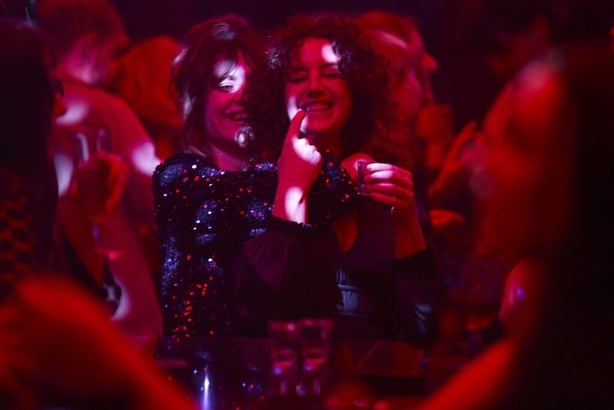 A scene from the Walsh sister showing two sisters dancing on a night out