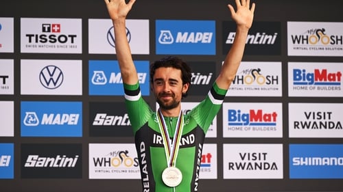 Ben Healy with his medal on the podium