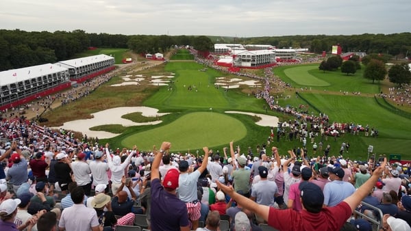 FARMINGDALE, NEW YORK - SEPTEMBER 27: Fans celebrate while watching play in the grand stands on the 18th green during the Saturday Afternoon Four-balls, during the Ryder Cup, at Black Course at Bethpage State Park Golf Course, on September 27, 2025 in Far