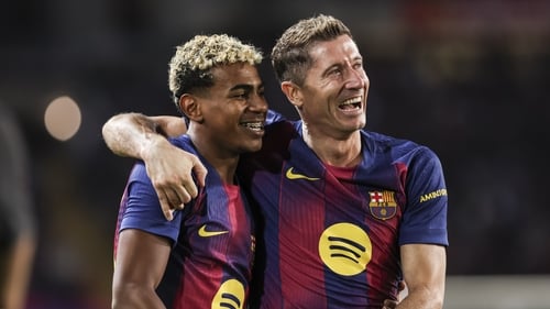Robert Lewandowski celebrates his goal with Lamine Yamal