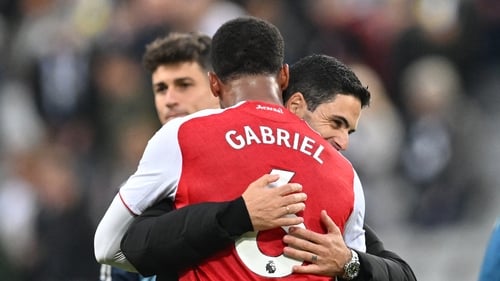 Mikel Arteta (R) hugs his defender Gabriel after the Arsenal defender scored the late winner at St James Park