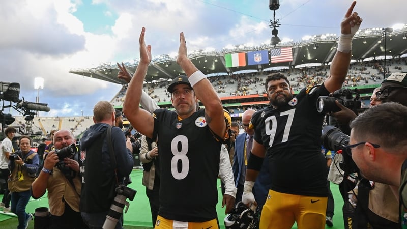 Pittsburgh Steelers quarterback Aaron Rodgers (8) and defensive tackle Cameron Heyward (97) celebrate after beating the Minnesota Vikings at Croke Park