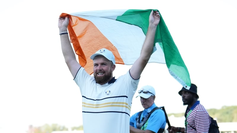 Shane Lowry celebrates after his putt to halve the hole and retain the Ryder Cup for Europe on the 18th green