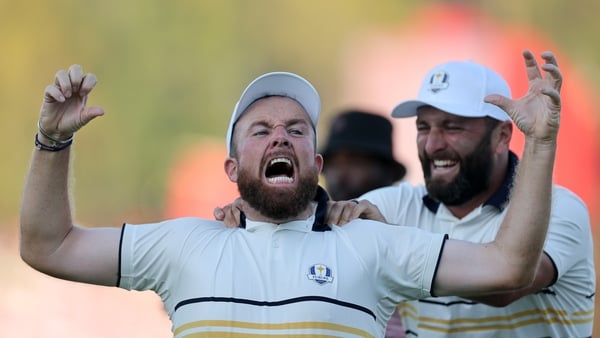 FARMINGDALE, NEW YORK - SEPTEMBER 28: (L-R) Shane Lowry of Team Europe and Jon Rahm of Team Europe celebrate after Lowry's putt to halve the hole and retain the Ryder Cup on the 18th green 
 during the Sunday singles matches of the 2025 Ryder Cup at Black