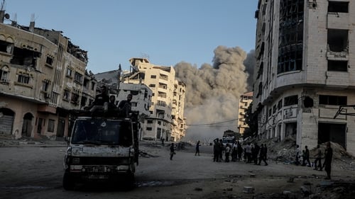 Smoke rises after Israeli airstrikes hit a multi-storey building in Gaza City