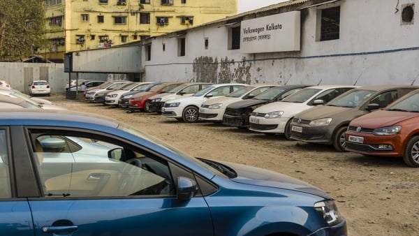 Parked Volkswagen cars outside a showroom in India