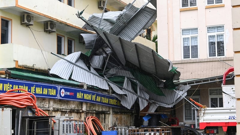 Corrugated metal roofs were blown off buildings in the coastal province of Nghe An