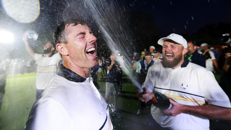 Rory McIlroy is drenched with champagne by his friend and inspiration Shane Lowry