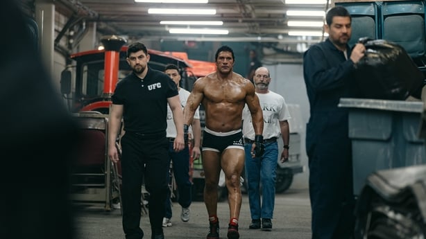 Mark Kerr (Dwayne Johnson) makes his way to the ring in The Smashing Machine