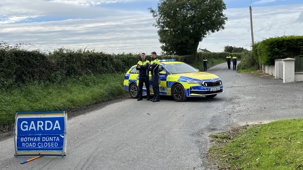 Gardai are searching the road not far from the scene of this mornings killings