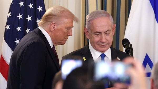 Donald Trump (L) and Israeli Prime Minister Benjamin Netanyahu arrive for a joint news conference in the State Dining Room at the White House