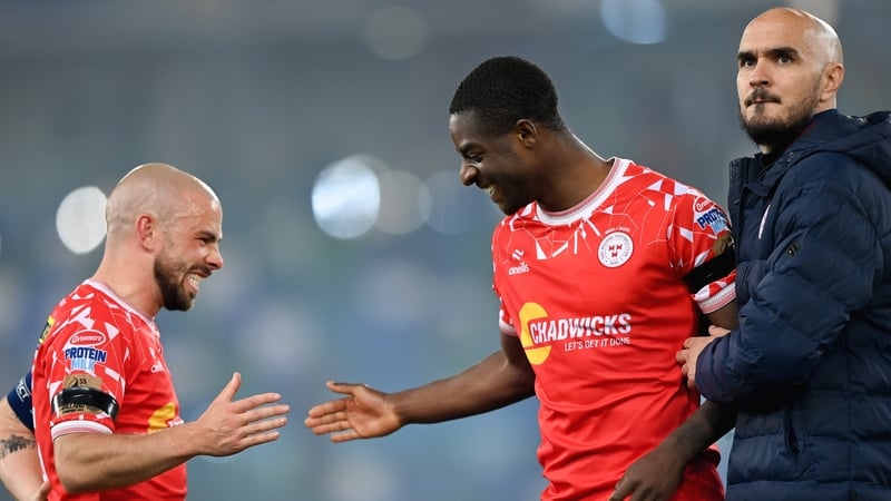 Shelbourne captain Mark Coyle (L) with Mipo Odubeko and Joey O'Brien after the triumph over Linfield