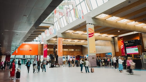 People gather in the departures area of Shannon Airport
