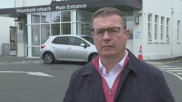 Labour TD Alan Kelly speaking to media in a car park of a hospital