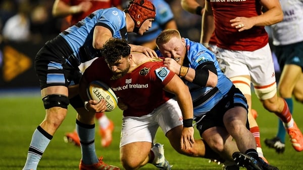25 April 2025; Michael Milne of Munster is challenged by Kieron Assiratti of Cardiff during the United Rugby Championship match between Cardiff and Munster at Cardiff Arms Park in Cardiff, Wales. Photo by Kian Abdullah/Sportsfile