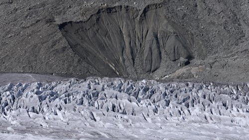 Seracs point upward from a portion of the Aletsch Glacier under a collapsing moraine near Bettmeralp, Switzerland