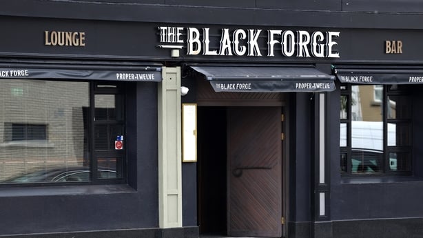 The black exterior of a pub called The Black Forge