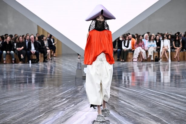 A model presents a creation by Dior