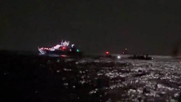 A screenshot of a video shows an Israeli vessel approaching aid flotilla boats
