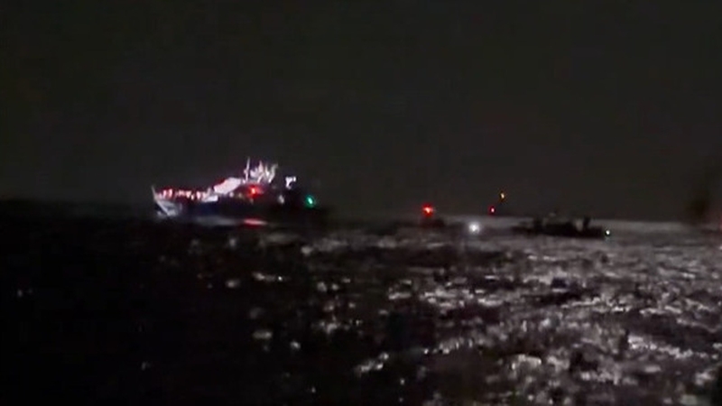 A screenshot of a video posted by French MEP Rima Hassan shows an Israeli vessel approaching aid flotilla boats