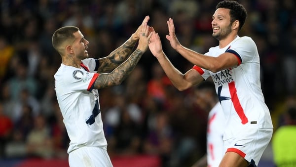 BARCELONA, SPAIN - OCTOBER 01: Goncalo Ramos of Paris Saint-Germain celebrates with teammate Lucas Hernandez after scoring his team's second goal during the UEFA Champions League 2025/26 League Phase MD2 match between FC Barcelona and Paris Saint-Germain