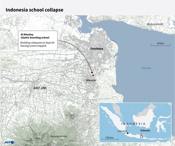 A map shows the location of a school collapse in Indonesia