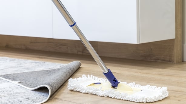 Wooden floor with white a mop