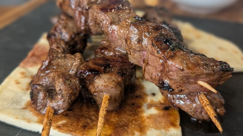 These tender and juicy beef skewers are topped with a sweet and sticky sauce.