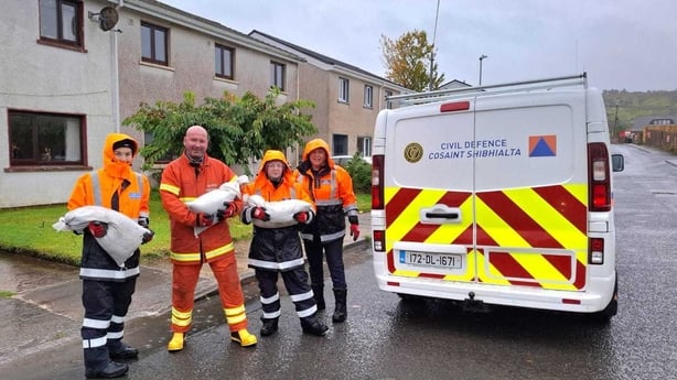 Members of the Civil Defence are seen with sandbags in Donegal town
