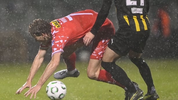 Harry Wood of Shelbourne is tackled by Adam Lundqvist of Hacken during the UEFA Conference League 2025/26 league phase match between Shelbourne and Hacken at Tallaght Stadium in Dublin.
