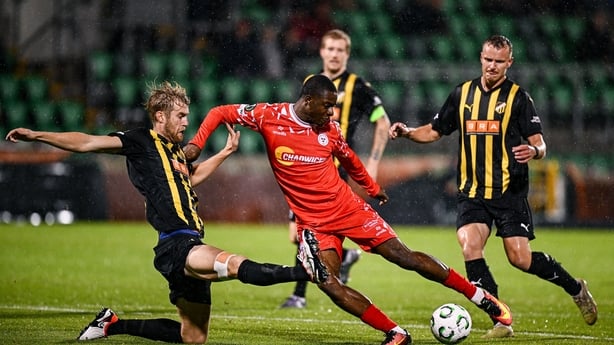 Mipo Odubeko of Shelbourne is tackled by Filip Helander of Hacken during the UEFA Conference League 2025/26 league phase match between Shelbourne and Hacken at Tallaght Stadium in Dublin.