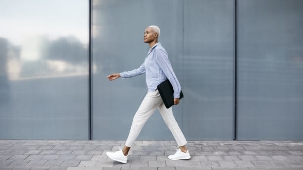 A woman walks to work outdoors